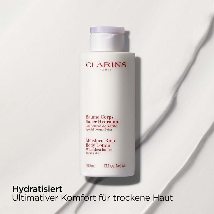 Clarins Baume Corps Super Hydratant mit Text, der die nährende Wirkung des Produkts bei trockener Haut hervorhebt.