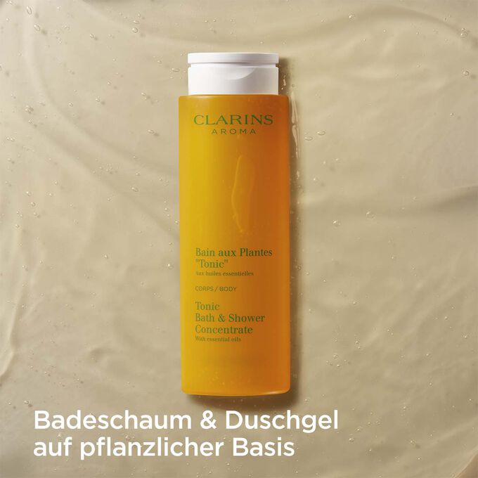 Clarins Bain Tonic mit Text, der betont, dass es sich um Badeschaum und Duschgel auf Pflanzenbasis handelt.