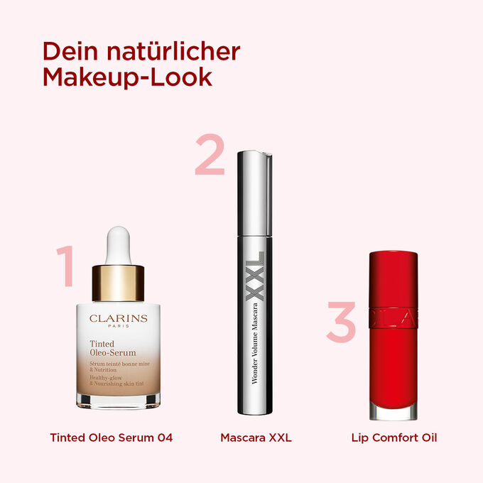 Clarins Makeup-Auswahl für einen natürlichen Look mit getöntem Serum, volumengebender Mascara und rotem Lippenöl.