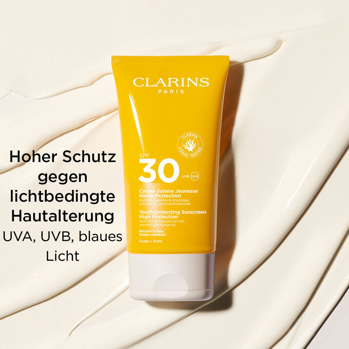 Tube Clarins Crème Solaire Jeunesse SPF 30 für den Körper mit Textinfo zum hohen Schutz vor UVA, UVB und blauem Licht.