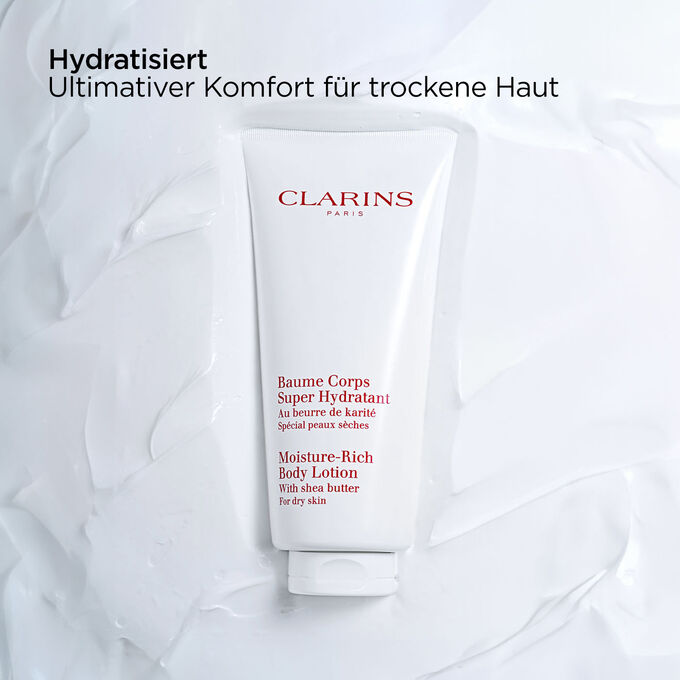 Clarins Baume Corps Super Hydratant mit Text, der die nährende Wirkung des Produkts bei trockener Haut hervorhebt.