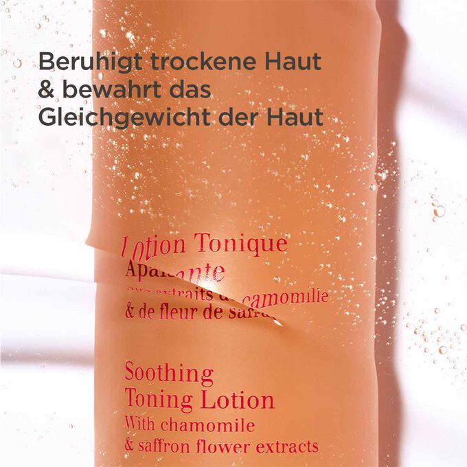 Oranger Flakon der beruhigenden tonisierenden Gesichtslotion halb unter Wasser mit Text beruhigend und hydratisierend