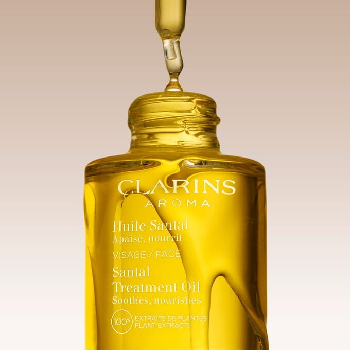 Clarins Huile Santal Gesichtspflege&ouml;l, mit Text, der die pflegende  Wirkung des Produkts hervorhebt