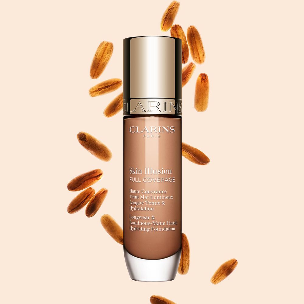 Clarins Skin Illusion Full Coverage showcasing its sleek design and vibrant packaging, the ideal foundation for a flawless & natural complexion.